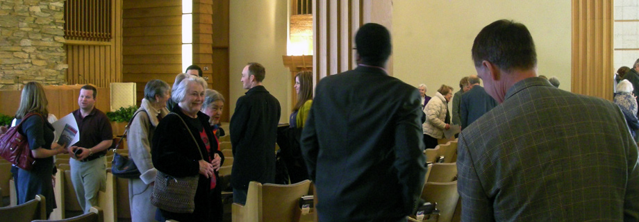 image of people congregating after a service