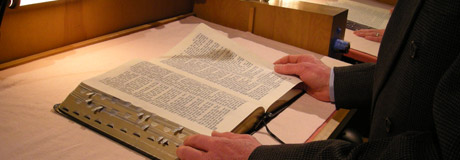 image of open Bible at a desk